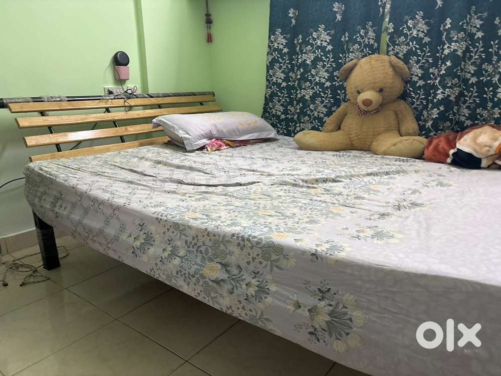 Sofa come bed . Iron cot with wooden base