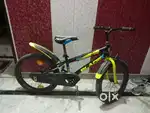 One year old cycle with side wheels