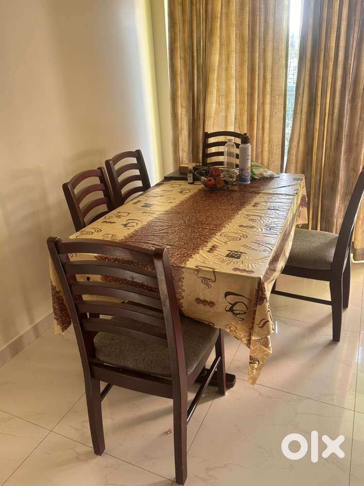 6 seater wooden dining table and 6 chairs on sale