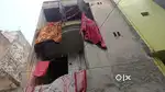 There is a 35 yard old three storey house in16 feetstreet inSant Nagar