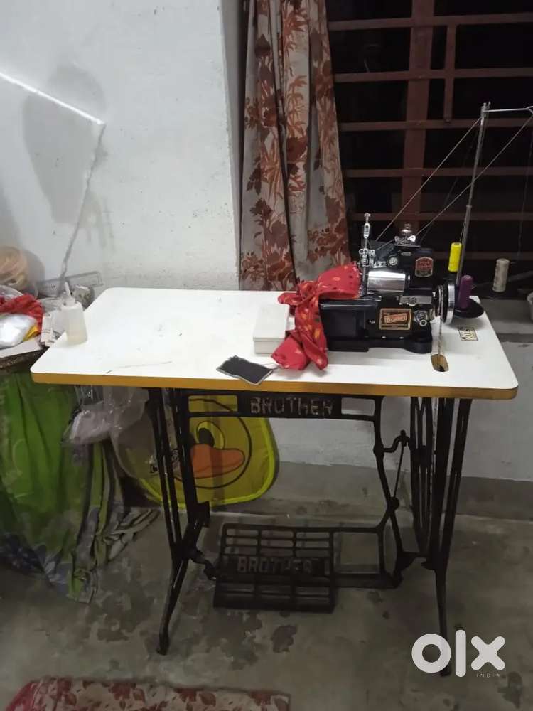 Interlock sewing machine with table