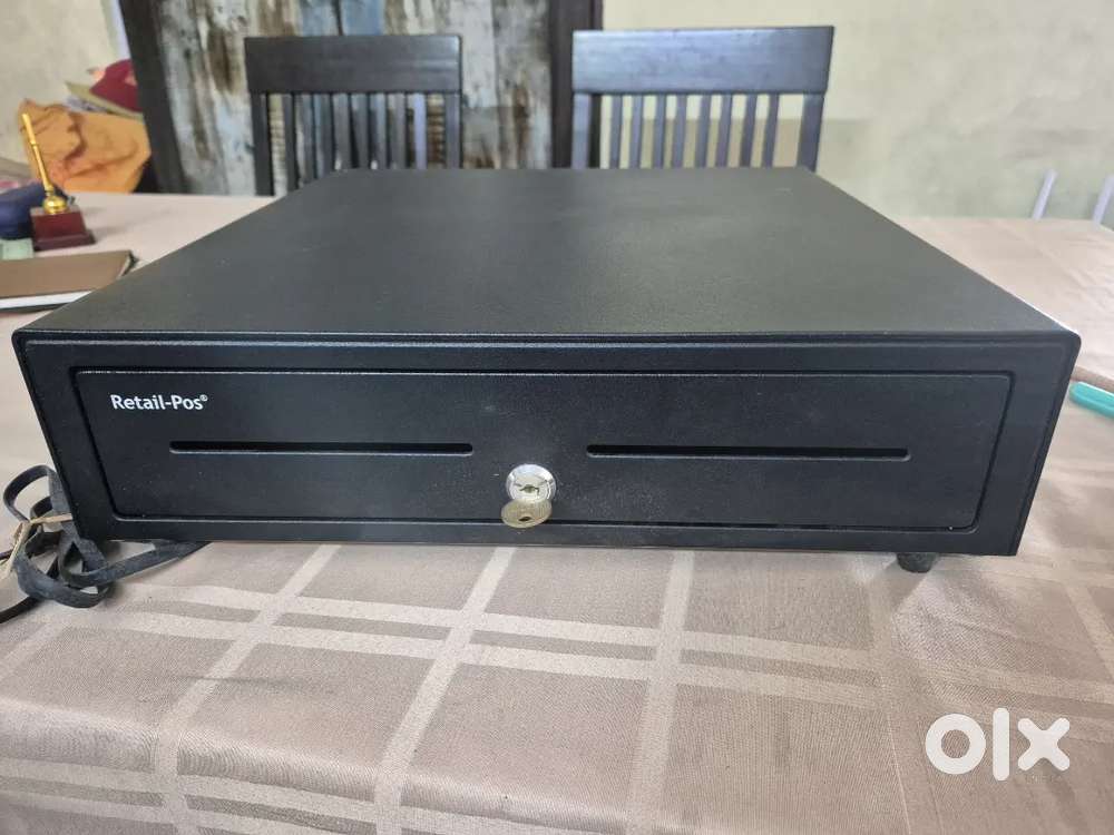 Electronic cash register drawer ..