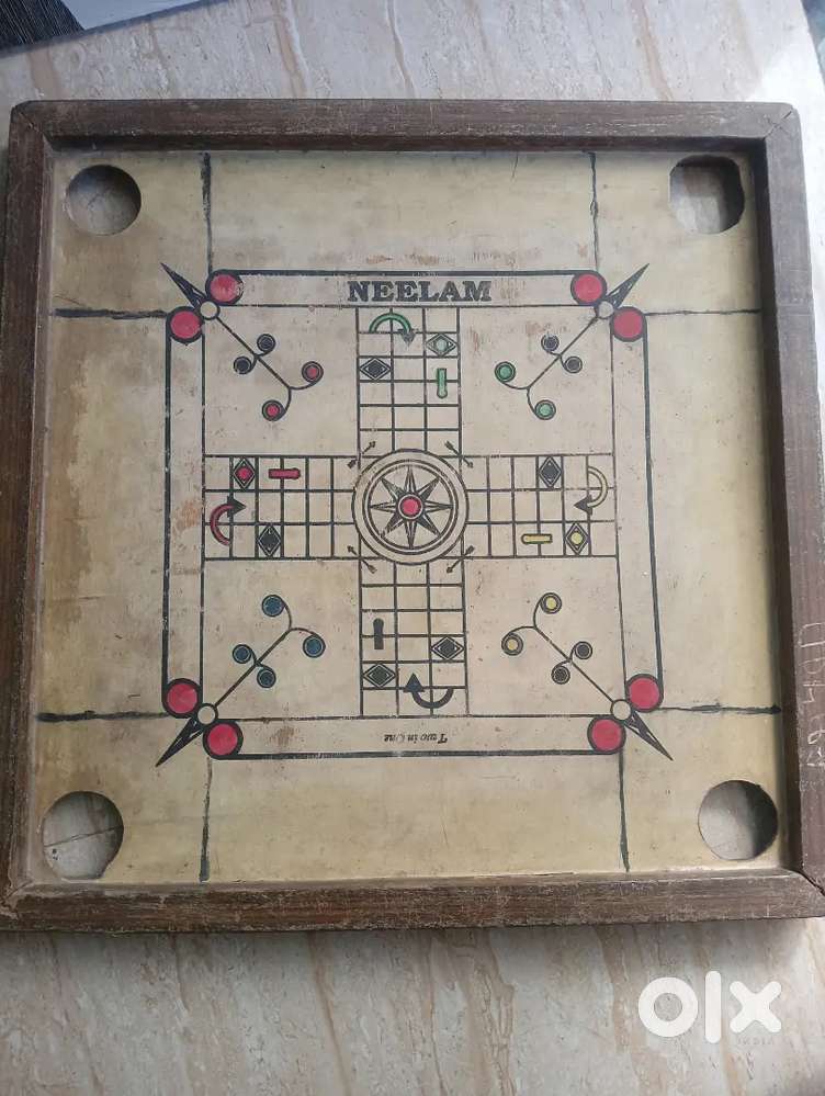 Carrom board toy for 4 player indoor game.