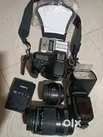 Canon 70D with 50mm and 15-135mm lens with flash and bag