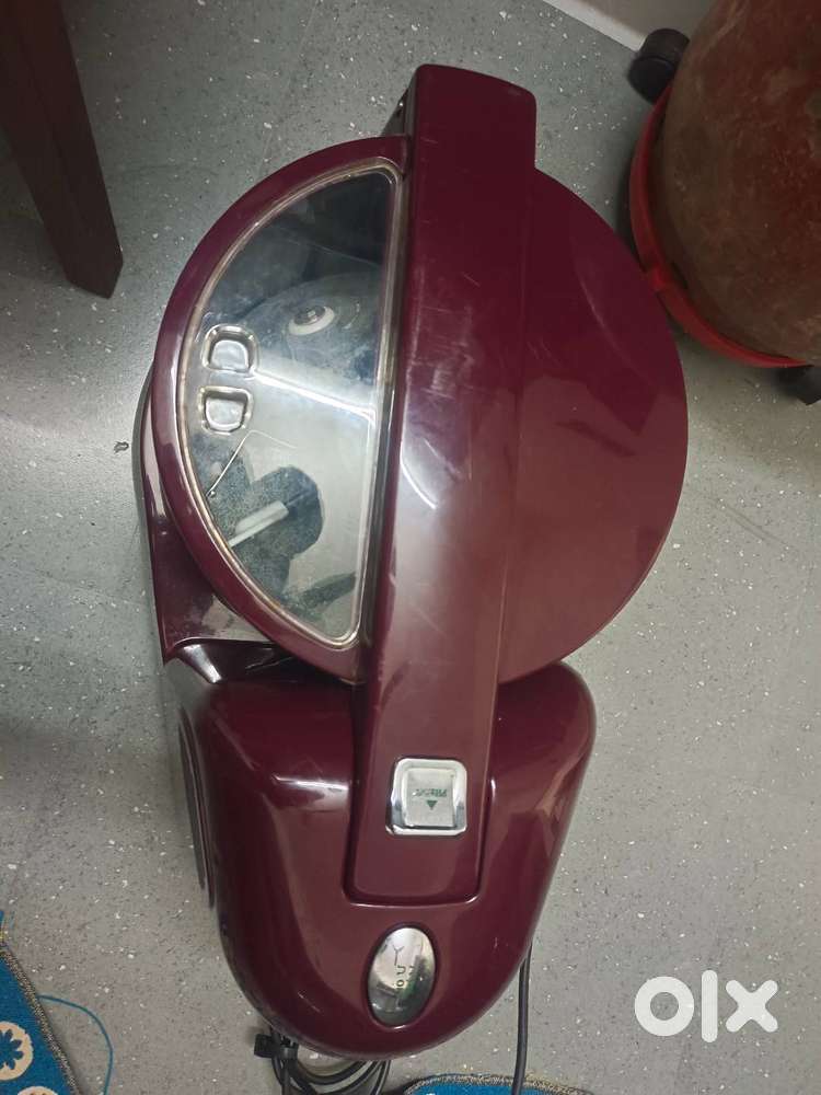 Grinder with coconut scrusher