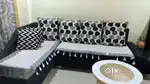 L-shaped black Sofa + white shoe rack