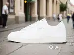 A pair of unisex puma white colour shoes