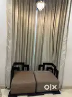 Two big sagwan wood sofa chairs with four cushions