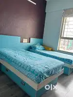 Two Single beds, cabinets and study/work desk