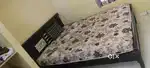 Bed with mattress one leg broken