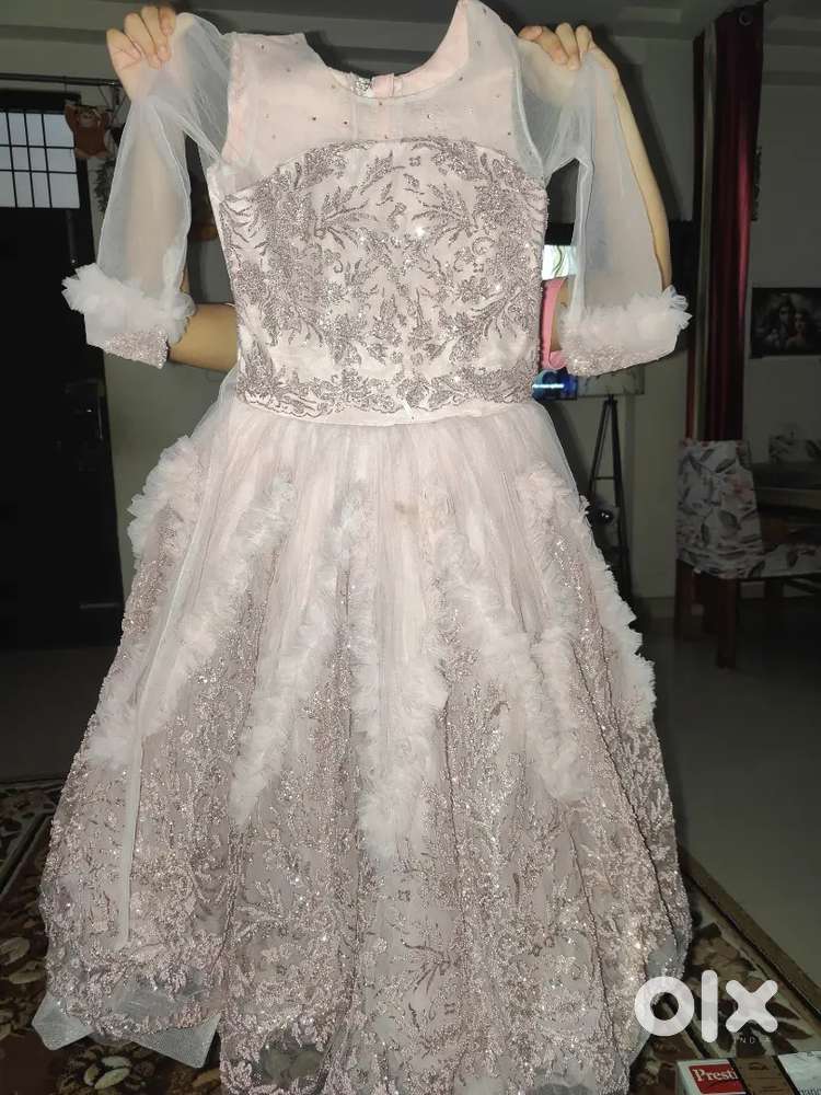 Brand new light purple gown .