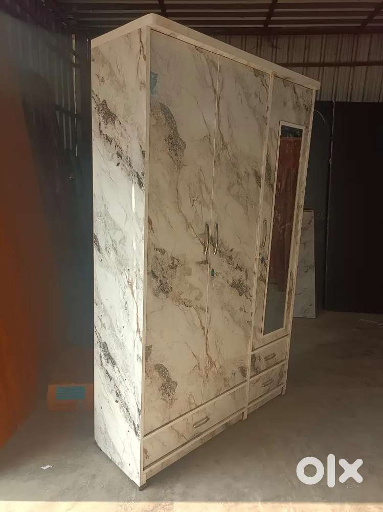 Unused new 3 doors wooden wardrobe 78*48 inches available