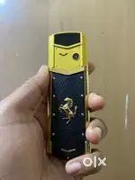 Golden keypad phone with box and charger