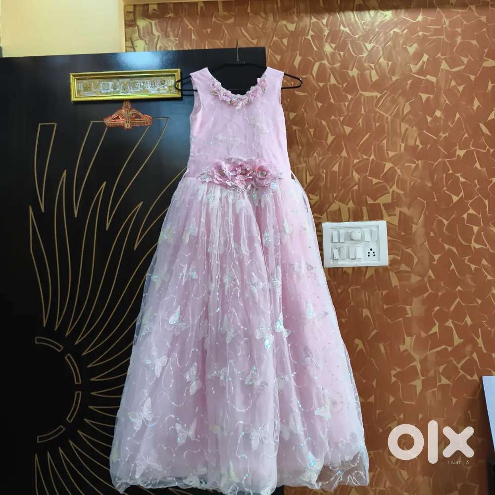 It's a frock of pink colour with flowers in centre and butterfly
