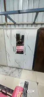 Selling this brand new 3 door wardrobe with mirror locker and drawer