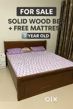 solid wood double bed with carved design, in excellent condition.