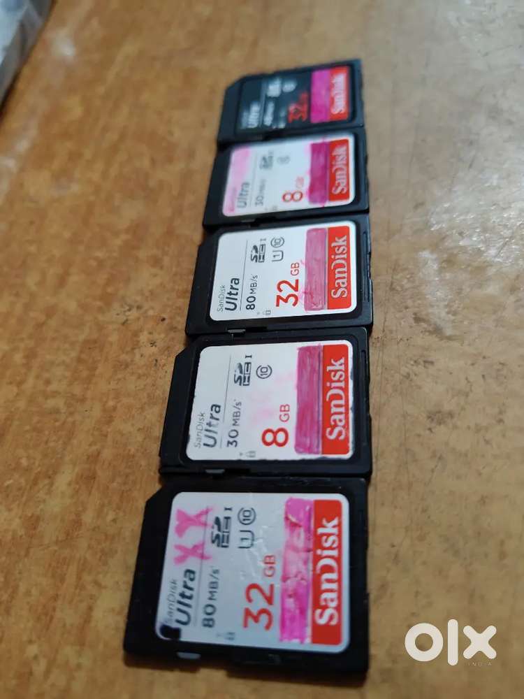 5 used SD memory cards for sale.