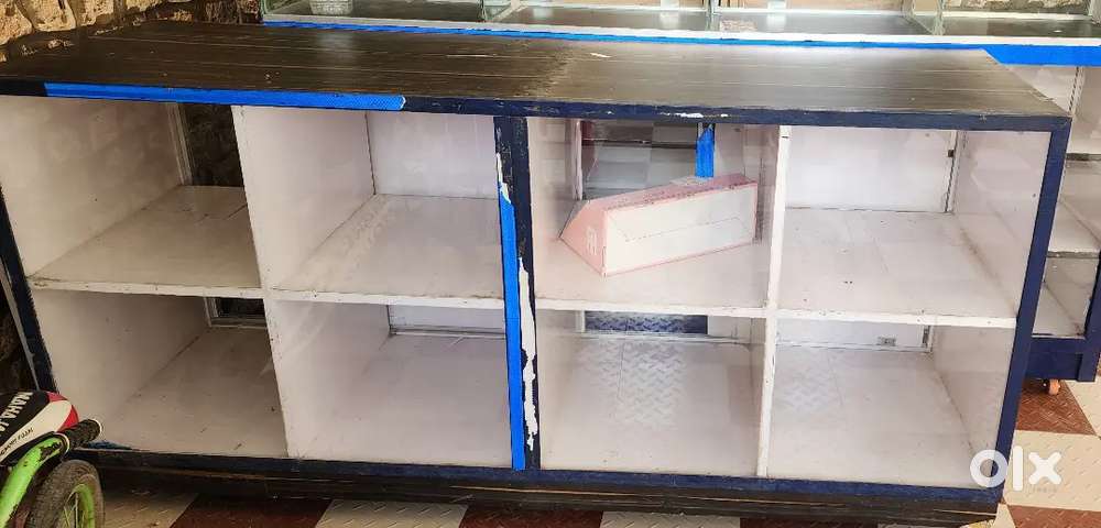 Storage shelf with glass cupboard