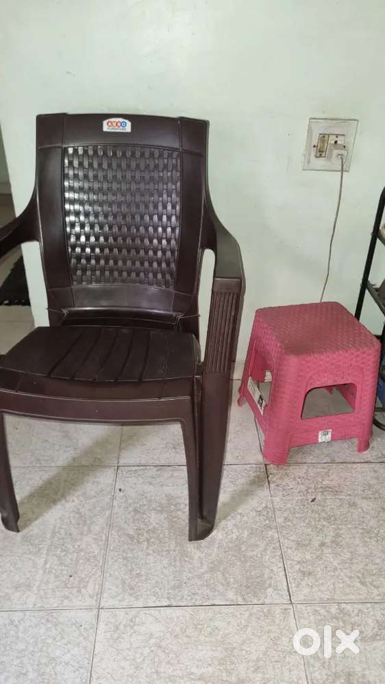 2 plastic chairs and 2 stools