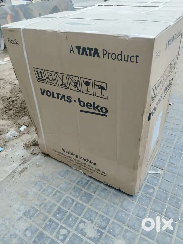 Brand new Voltas brand new 5year warrenty washing mashin with bil