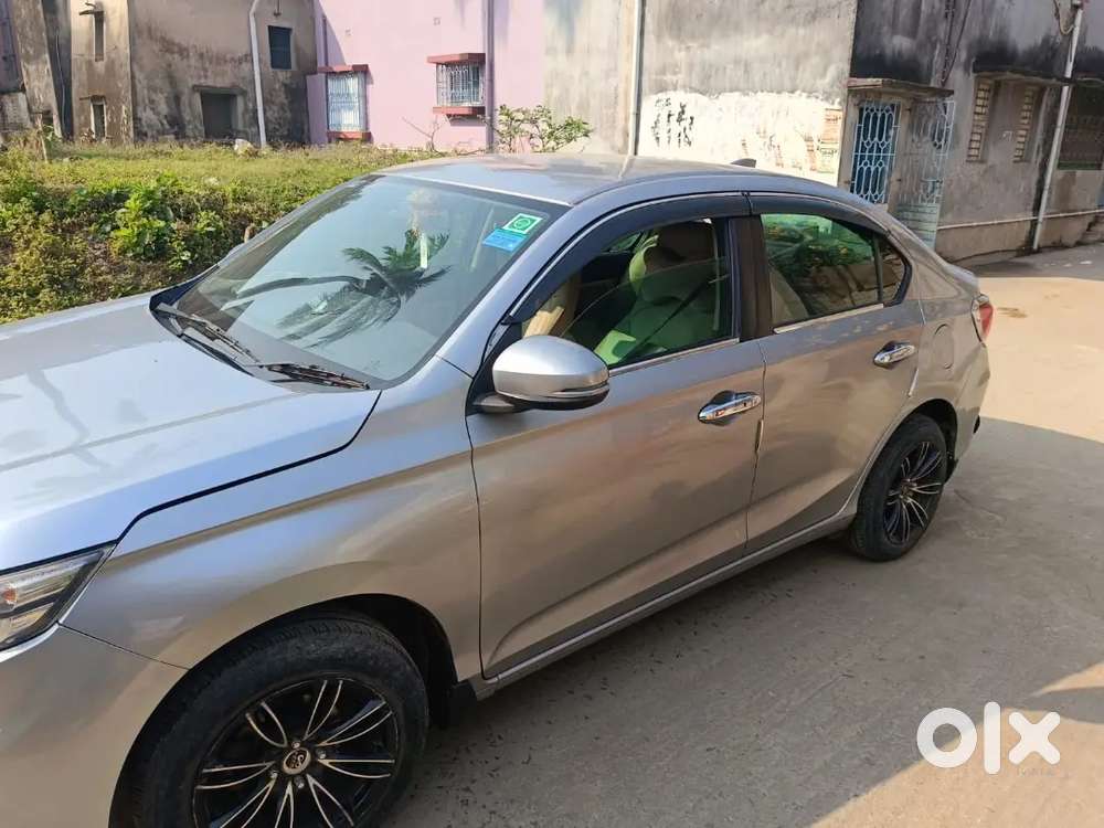 Honda Amaze 2021 Petrol Well Maintained, and loads of extra fittings.