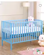 Blue Baby crib with mattress and mattress covers