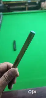 Nagee gold one, one piece cue.