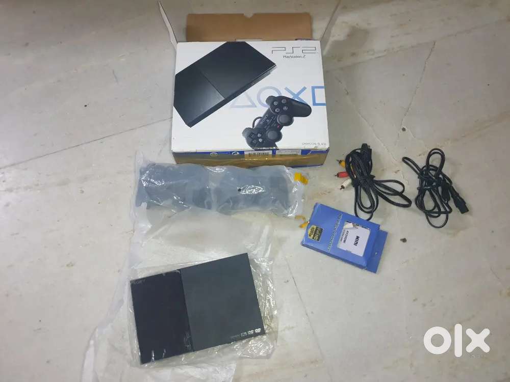 A PlayStation 2 with 2 original controllers and all accessories