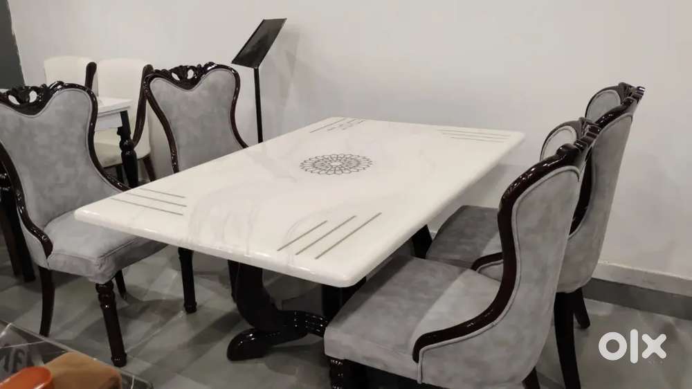 4 chair dinning table and designing chair with beautiful marble