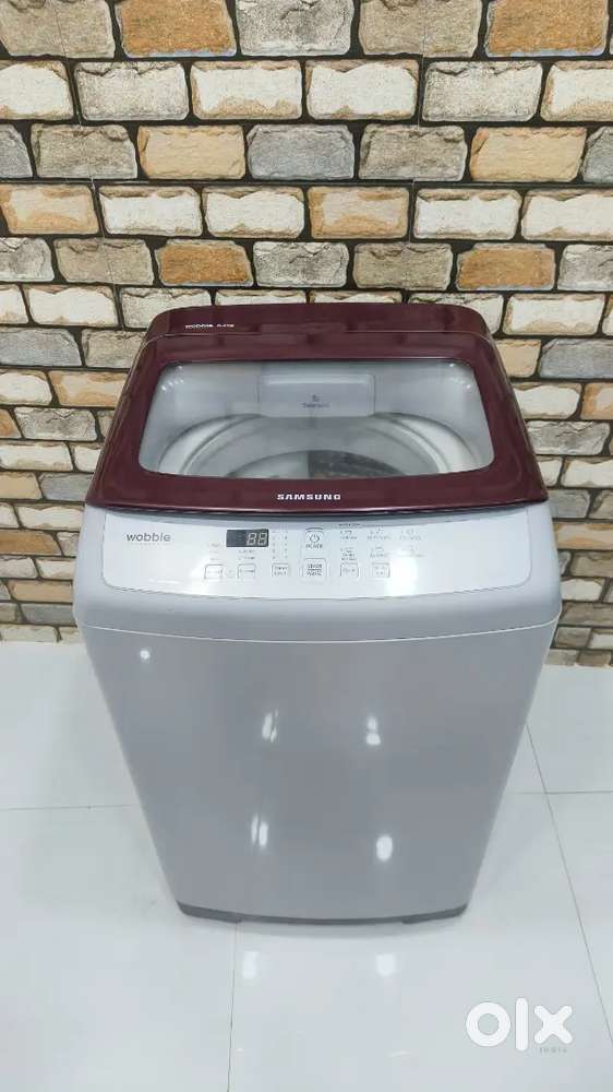 Maroon and silver colour samsung wobble technology machine with pipes