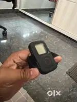 Go pro remote in new condition with company stickers on it