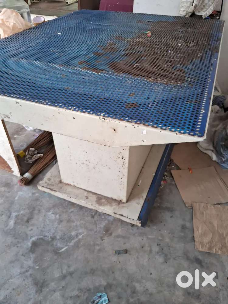 Ironing table for stitching unit with boiler