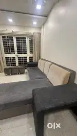 L shaped sofa with ottmans and center table- excellent condition