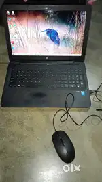 HP laptop with HP charger and HP mouse