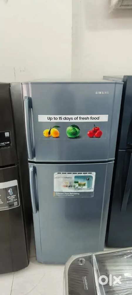 Samsung double door fridge good condition with warranty 1 year old