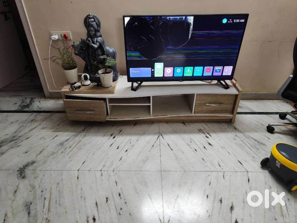 50 inch broken TV along with TV Cabinet for sale