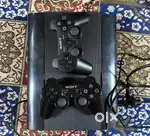 Playstation 3 with 2 wireless controller with 15 games invuilt