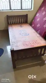 Wooden Bed , foldable table and solid plastic chairs