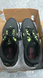 Black and green colour shoes