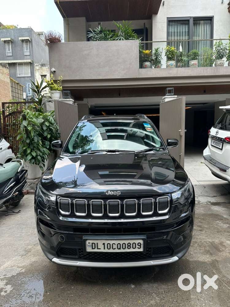 Jeep compass black color, very less driven