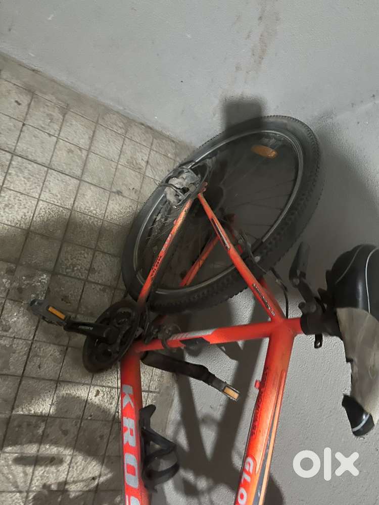 Orange colour bicycle with black shades