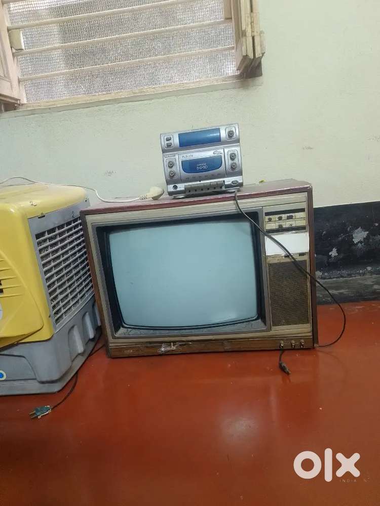 Old model Tv 24inch( 1986).one music system and a cooler
