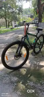 Hero next cycle with double disc brakes and front suspension.