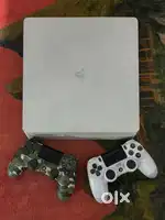 PS4 (2TB) with 2 Controllers & 4 Game Discs – Excellent Condition!