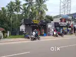 Commercial land with shops for sale at peyad junction.