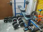 Gym bench press with weights and rods
