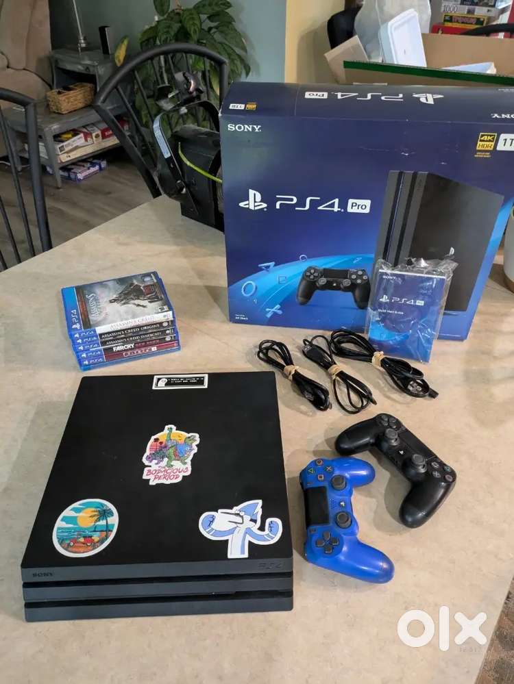 Sony PlayStation 4 Pro (in box) w/ 2 controllers, 7 games, and 2TB