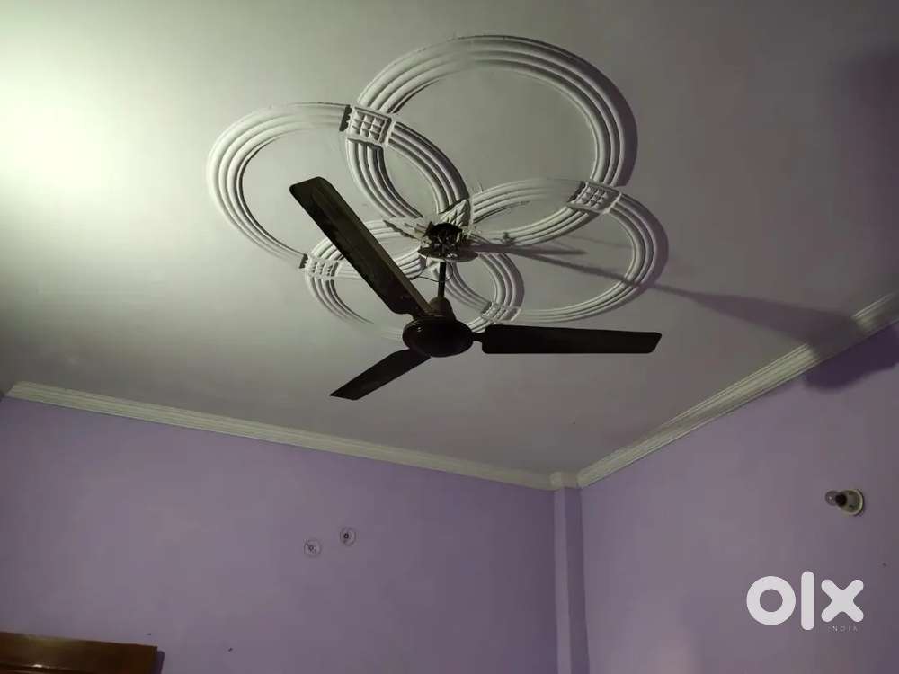 One room kitchen with fan bulb and bed