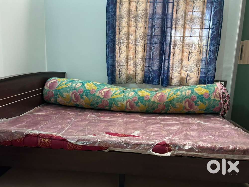 Wooden cot and mattress