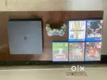 PS4 slim 1TB with controller and games.